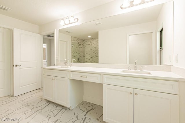 bathroom with a shower and vanity