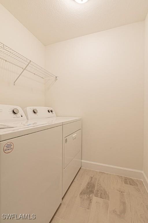 washroom with washing machine and dryer