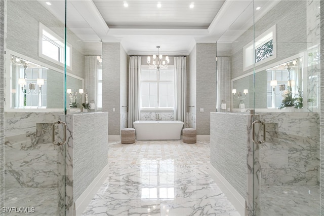 bathroom with a raised ceiling, tile walls, plus walk in shower, and an inviting chandelier