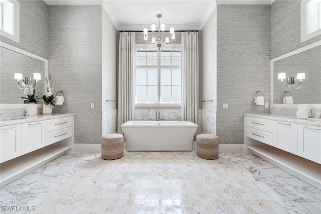 bathroom featuring a bathing tub, plenty of natural light, a chandelier, and ornamental molding