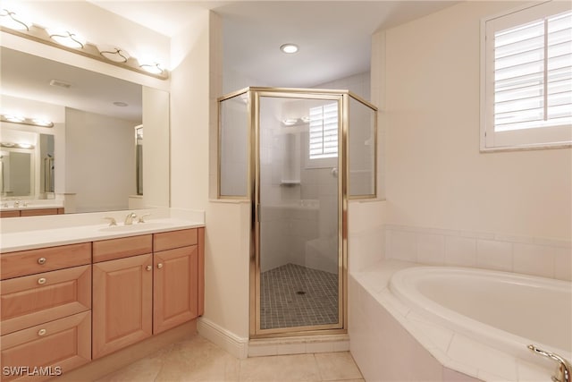 bathroom featuring shower with separate bathtub, tile patterned floors, and vanity