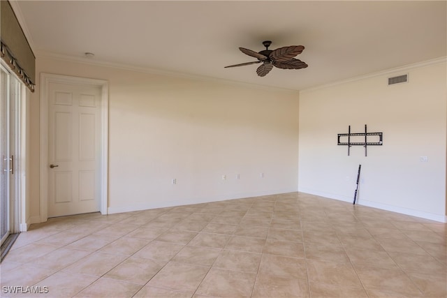 tiled spare room featuring ceiling fan and crown molding