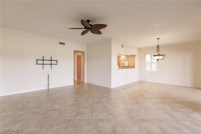 tiled empty room with ceiling fan with notable chandelier and crown molding