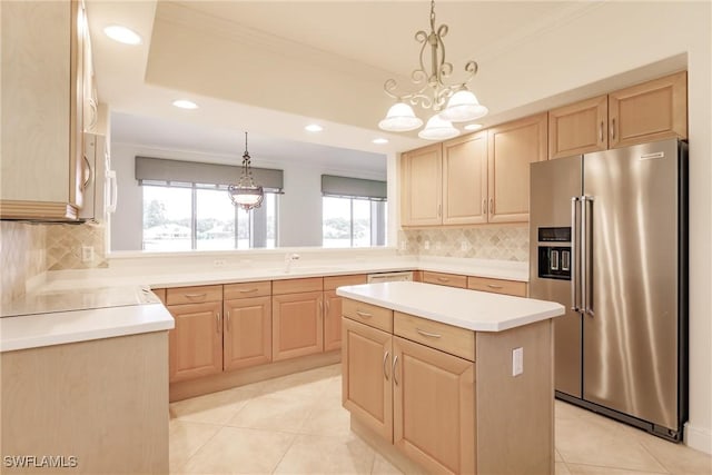 kitchen featuring light brown cabinetry, a chandelier, high end fridge, and backsplash
