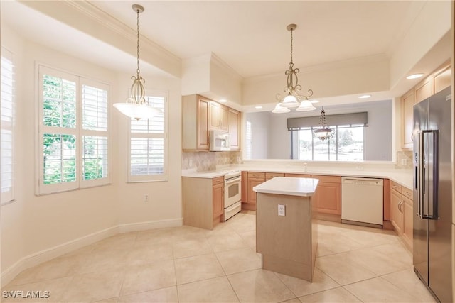 kitchen with light brown cabinetry, decorative backsplash, white appliances, and light countertops