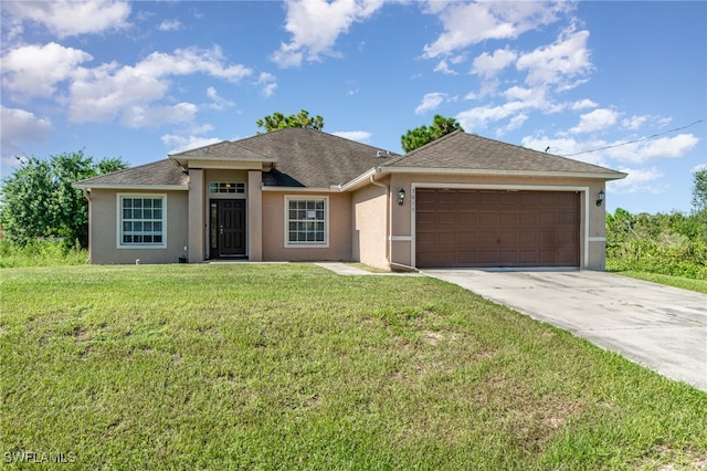 view of front of property with a garage and a front yard