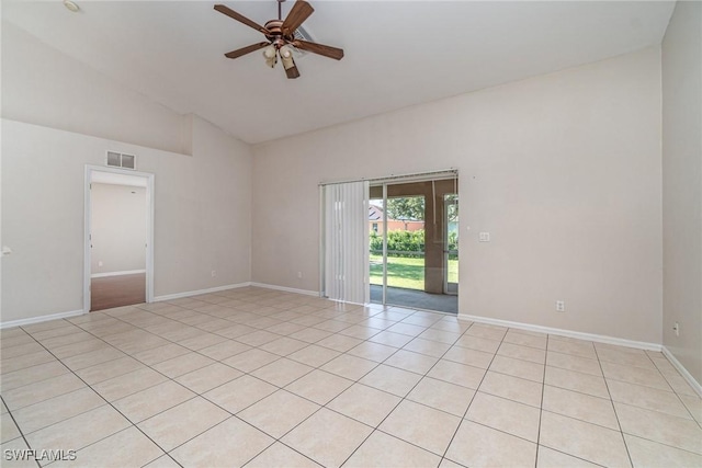 unfurnished room with ceiling fan, light tile patterned floors, and high vaulted ceiling