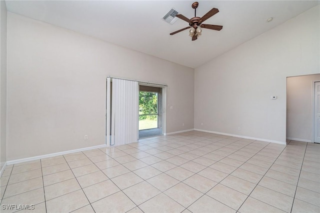 tiled empty room featuring ceiling fan and high vaulted ceiling