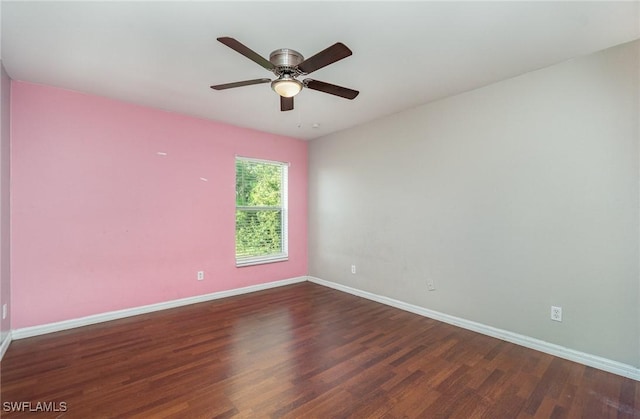 spare room with ceiling fan and dark hardwood / wood-style flooring