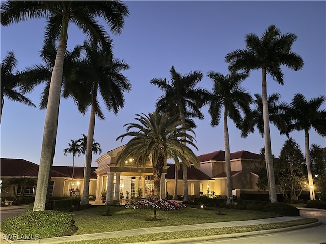 view of outdoor building at dusk