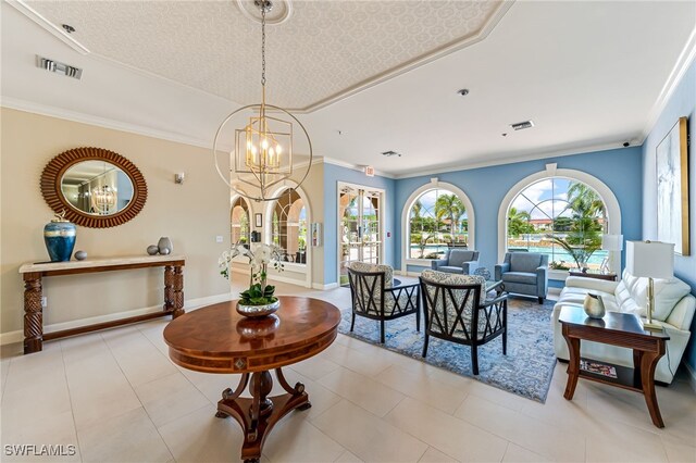 tiled dining space featuring a notable chandelier, ornamental molding, and plenty of natural light