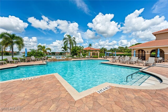 view of swimming pool featuring a patio