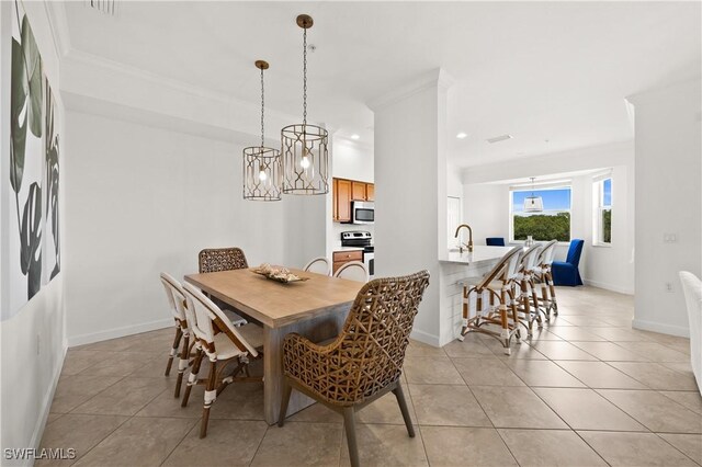 dining space featuring light tile patterned flooring, a chandelier, and ornamental molding