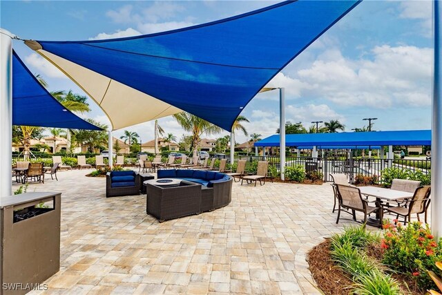 view of patio with a fire pit