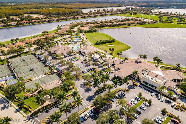 birds eye view of property with a water view