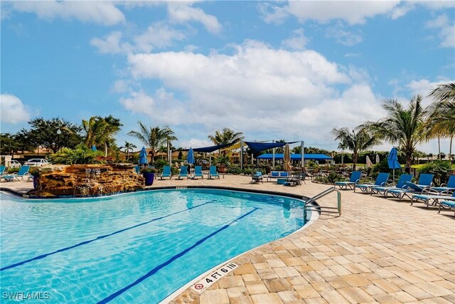 view of swimming pool with a patio area