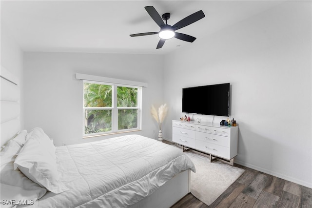 bedroom with hardwood / wood-style flooring, lofted ceiling, and ceiling fan