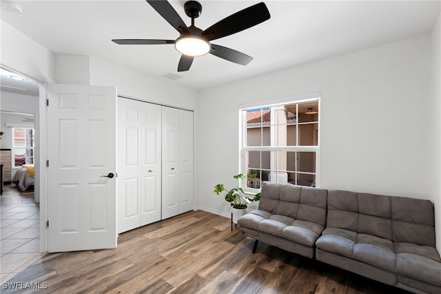 interior space featuring ceiling fan and hardwood / wood-style flooring