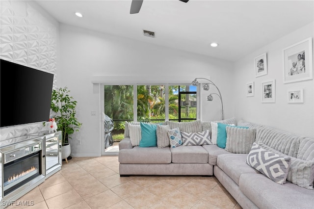 living room with ceiling fan and light tile patterned flooring