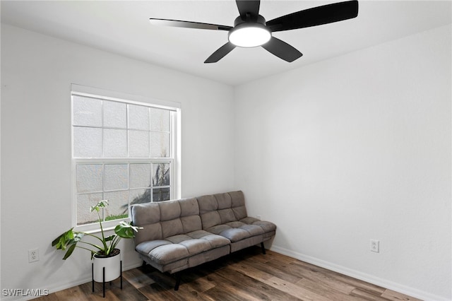 sitting room with ceiling fan and hardwood / wood-style floors