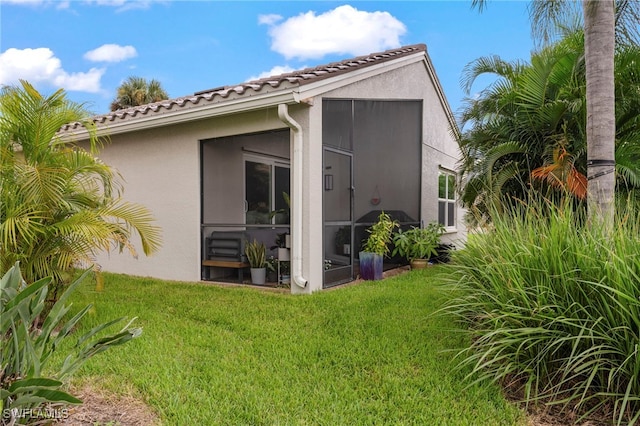 rear view of house with a lawn