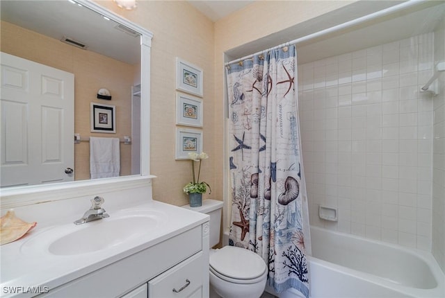 bathroom with shower / bath combo, visible vents, vanity, and toilet