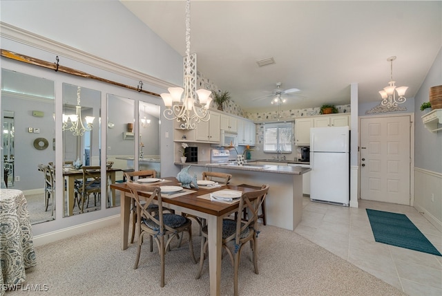 tiled dining room featuring ceiling fan and lofted ceiling