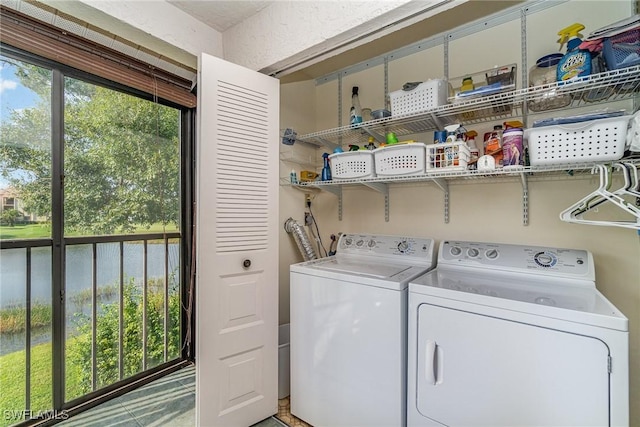 clothes washing area with laundry area and washer and dryer