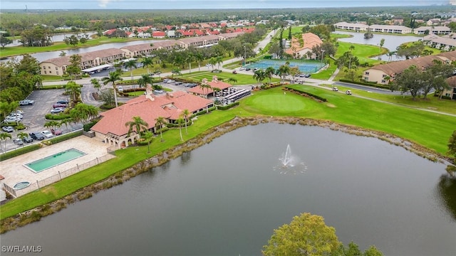 drone / aerial view featuring a water view and a residential view