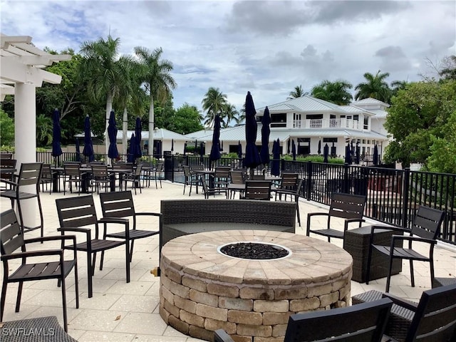 view of patio / terrace featuring a balcony and a fire pit