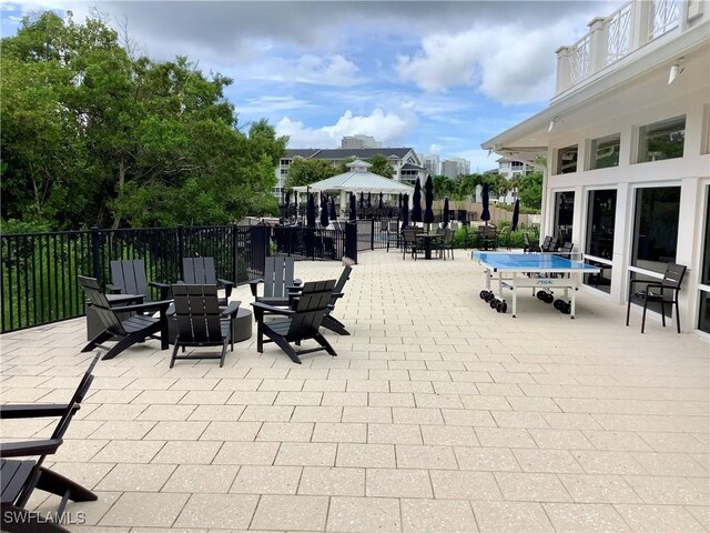 view of patio / terrace with a gazebo and a fenced in pool