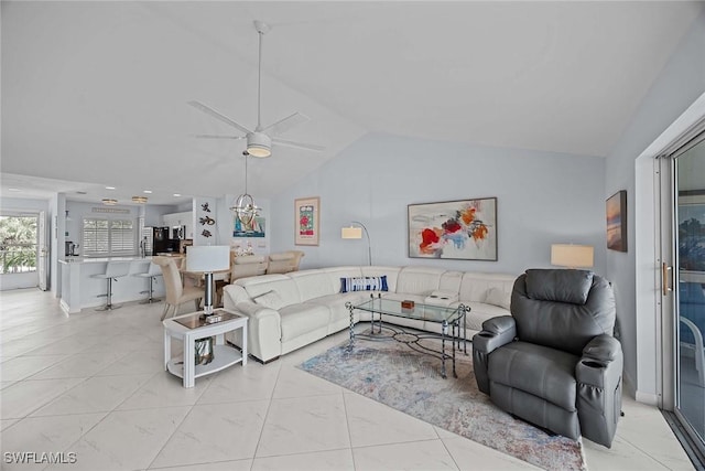 living room featuring ceiling fan and lofted ceiling