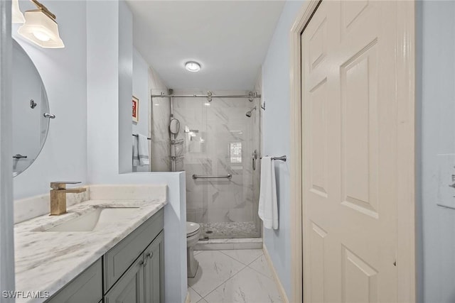 bathroom with a shower with shower door, toilet, and vanity