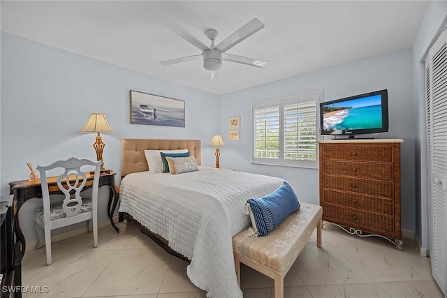 bedroom featuring ceiling fan and a closet