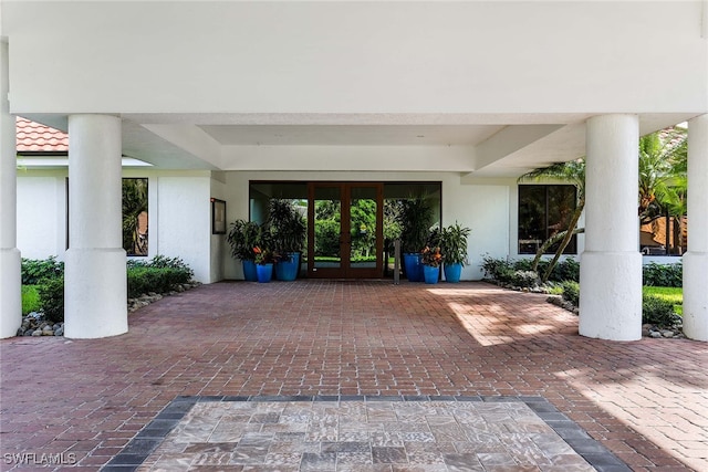 property entrance with french doors and a patio