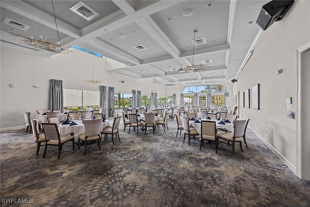 dining area with ceiling fan, beamed ceiling, a high ceiling, coffered ceiling, and dark colored carpet