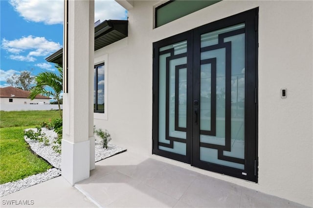 doorway to property featuring french doors