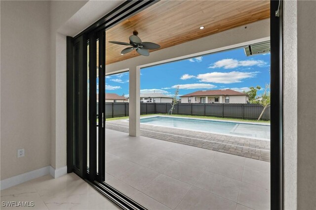 view of swimming pool featuring ceiling fan