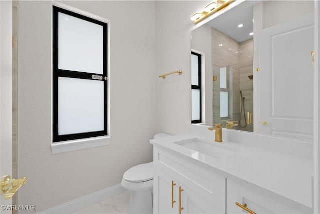 bathroom with vanity, toilet, and walk in shower