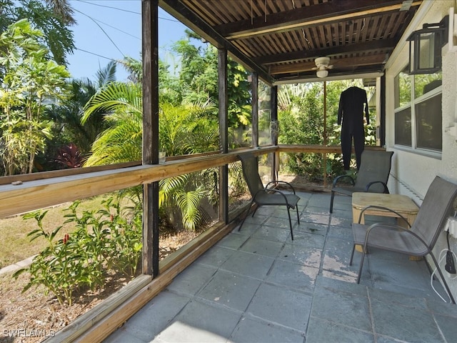 sunroom / solarium with ceiling fan