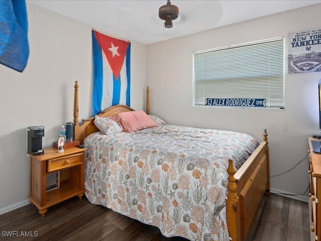 bedroom featuring ceiling fan and dark wood-type flooring