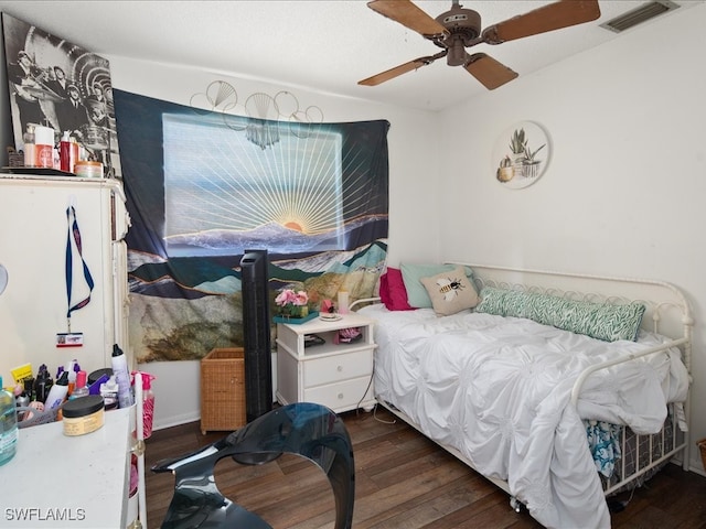 bedroom featuring ceiling fan and dark hardwood / wood-style floors