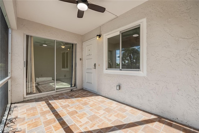 property entrance featuring a patio and ceiling fan