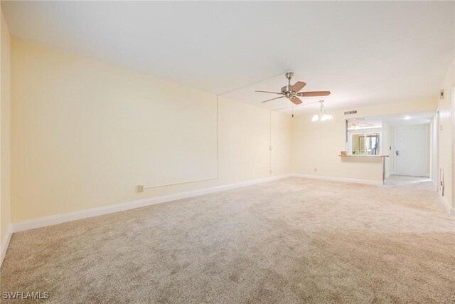 unfurnished room featuring light carpet and ceiling fan