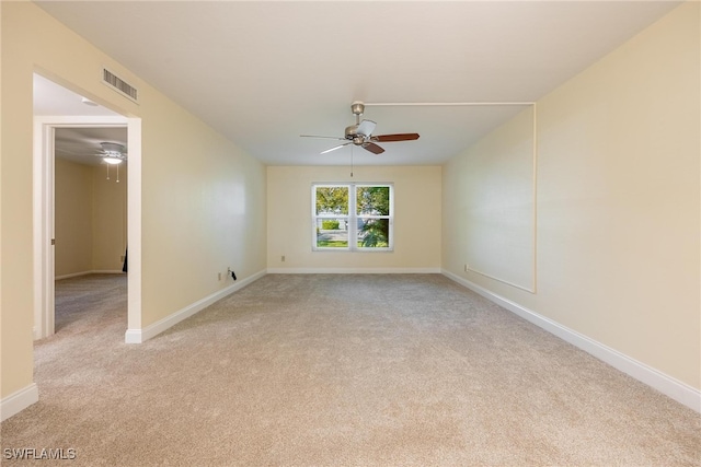 carpeted empty room featuring ceiling fan