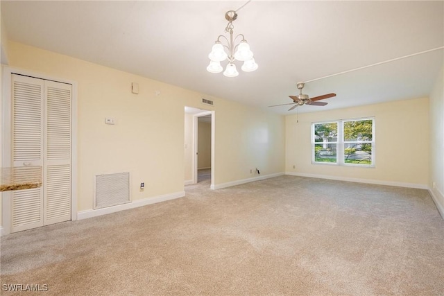2504 SE 16th Pl Unit 101, Cape Coral, FL 33904 - unfurnished room with a chandelier, light colored carpet, a ceiling fan, and baseboards