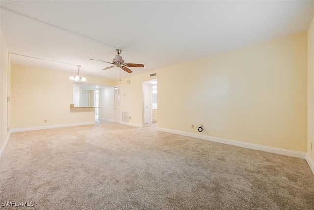 empty room with ceiling fan and carpet flooring