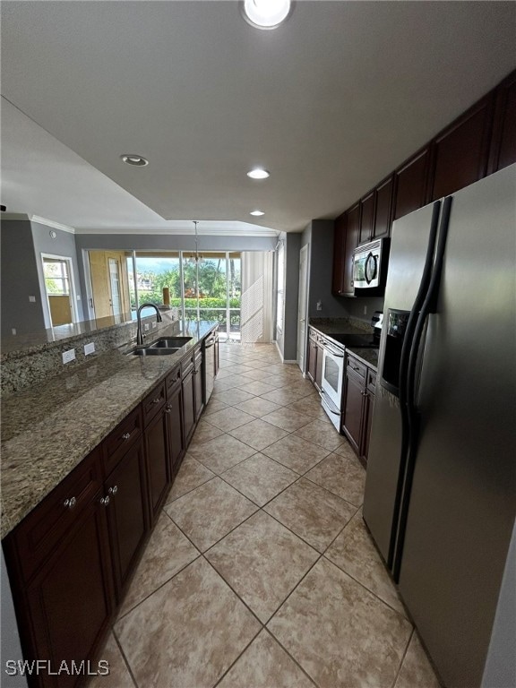 kitchen featuring light stone counters, sink, appliances with stainless steel finishes, dark brown cabinetry, and light tile patterned floors