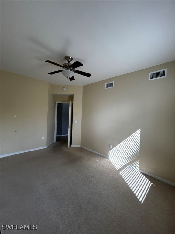 carpeted empty room with ceiling fan