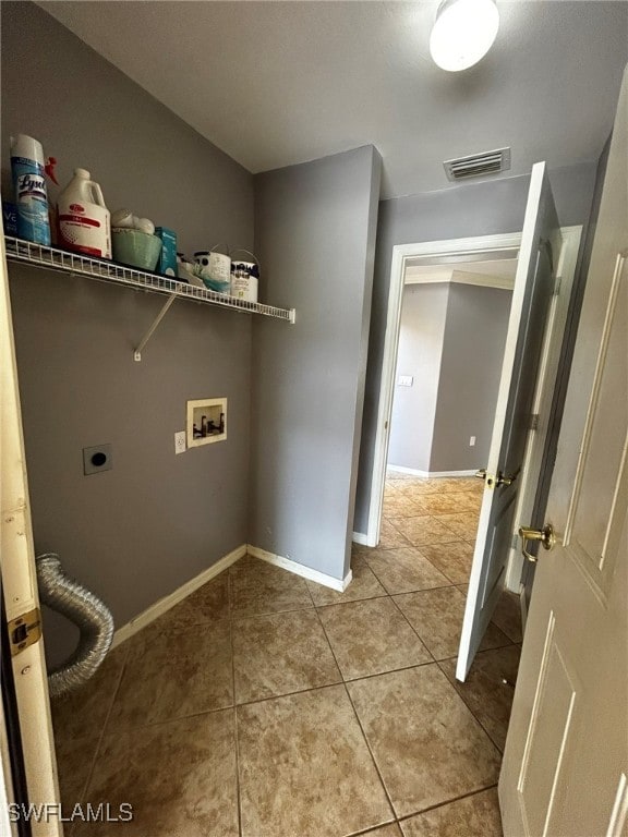 laundry room with hookup for a washing machine, hookup for an electric dryer, and light tile patterned floors